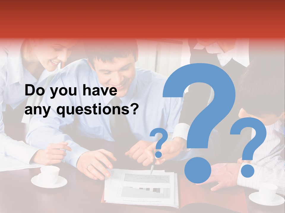 A Group Of People Sitting Around A Table Working On A Piece Of Paper PowerPoint Template