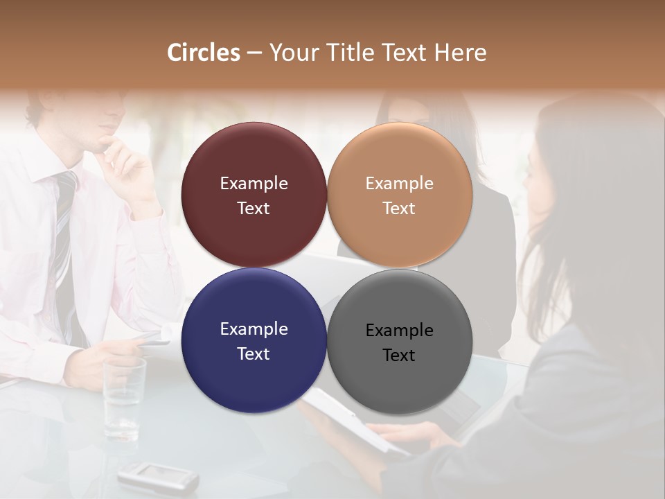 A Group Of People Sitting Around A Table With Laptops PowerPoint Template