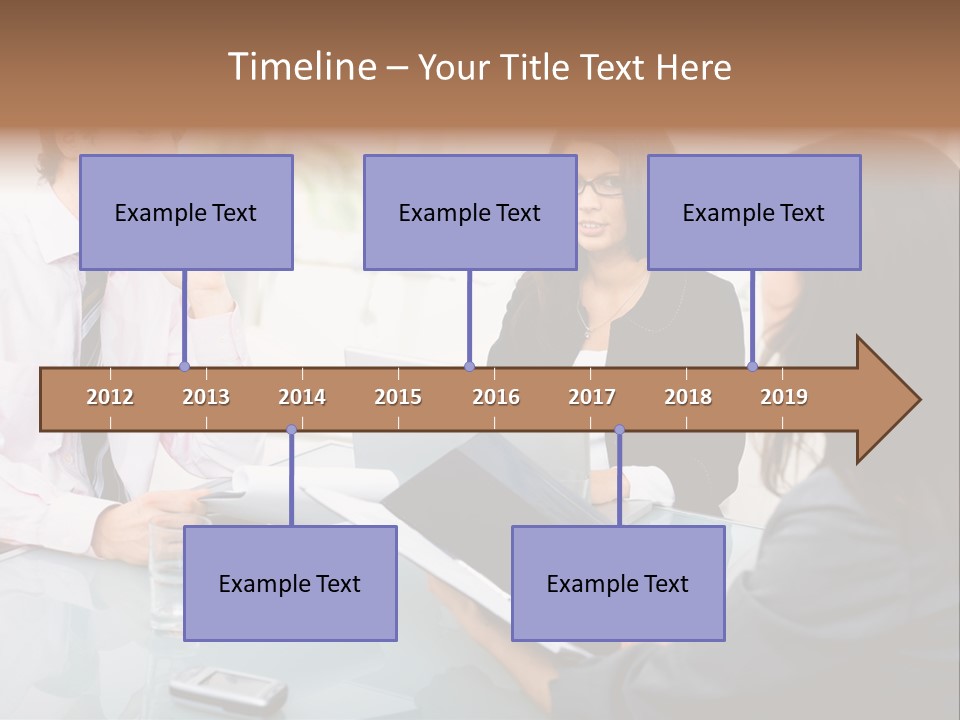 A Group Of People Sitting Around A Table With Laptops PowerPoint Template