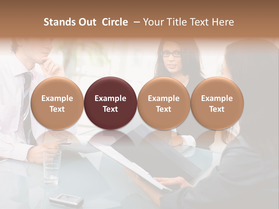 A Group Of People Sitting Around A Table With Laptops PowerPoint Template