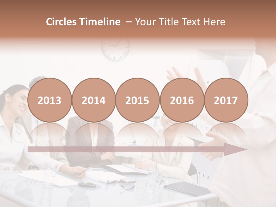 A Group Of Business People Sitting Around A Table PowerPoint Template