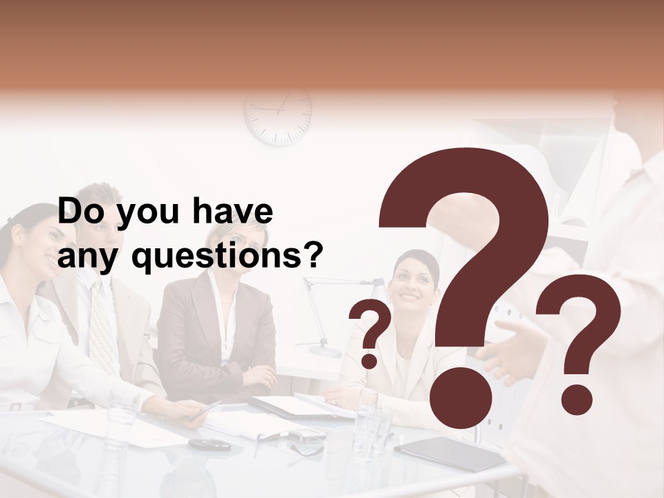 A Group Of Business People Sitting Around A Table PowerPoint Template