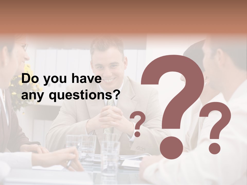 A Group Of People Sitting Around A Table Talking PowerPoint Template