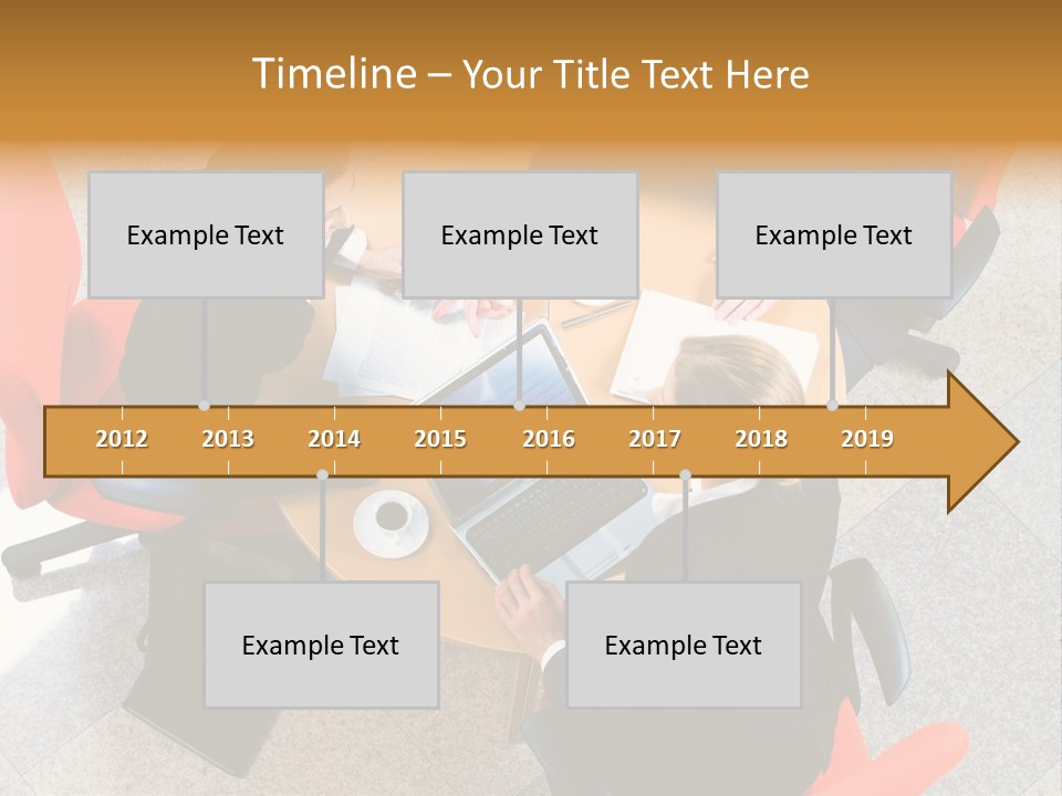 A Group Of People Sitting Around A Table With Laptops PowerPoint Template