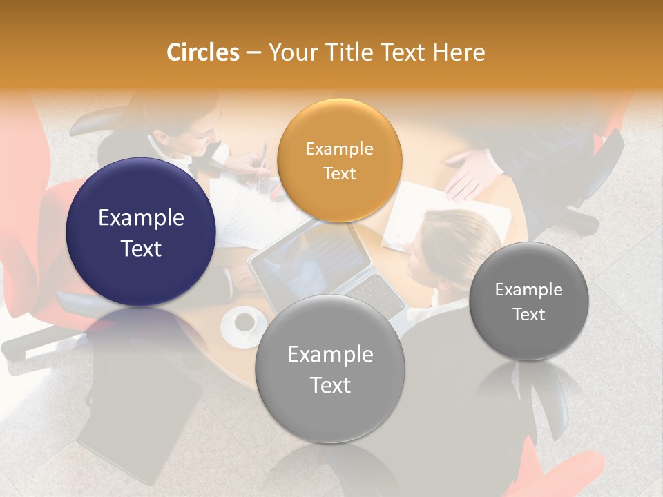 A Group Of People Sitting Around A Table With Laptops PowerPoint Template