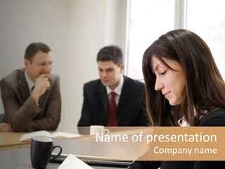 A Group Of People Sitting Around A Table PowerPoint Template