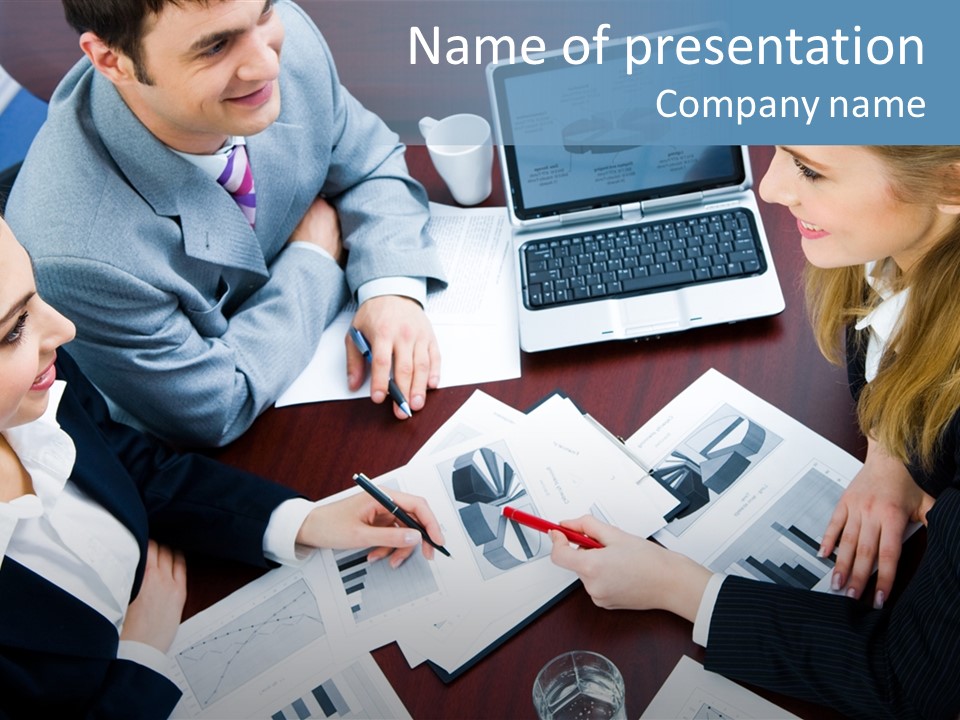 A Group Of People Sitting Around A Wooden Table PowerPoint Template