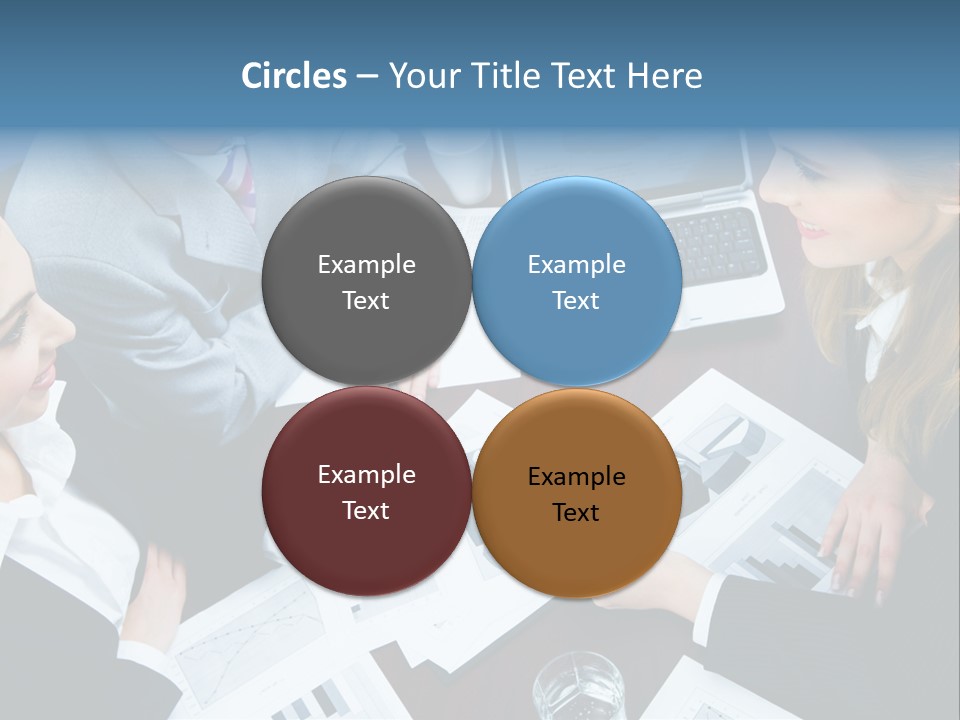 A Group Of People Sitting Around A Wooden Table PowerPoint Template