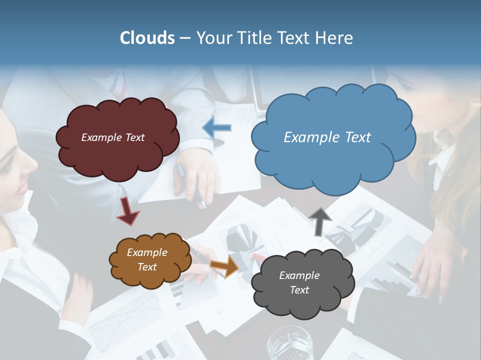 A Group Of People Sitting Around A Wooden Table PowerPoint Template