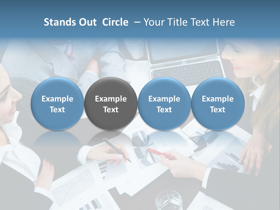 A Group Of People Sitting Around A Wooden Table PowerPoint Template