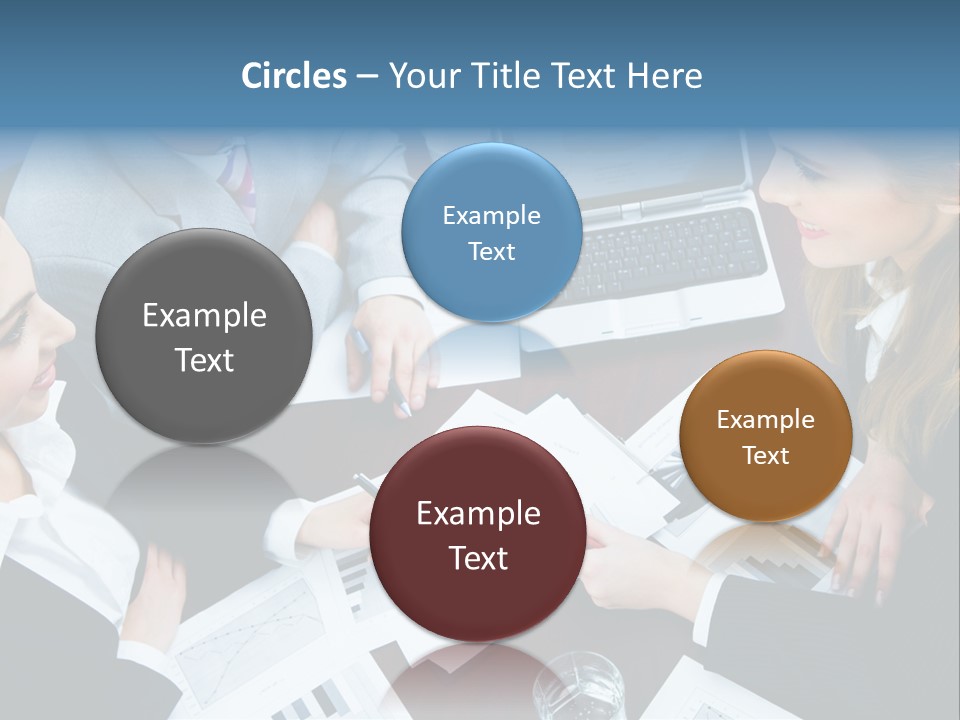 A Group Of People Sitting Around A Wooden Table PowerPoint Template