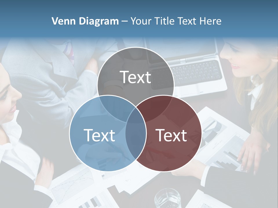 A Group Of People Sitting Around A Wooden Table PowerPoint Template