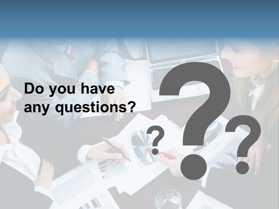 A Group Of People Sitting Around A Wooden Table PowerPoint Template