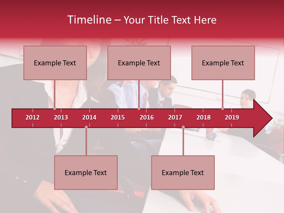 A Woman Sitting At A Table In Front Of A Group Of People PowerPoint Template