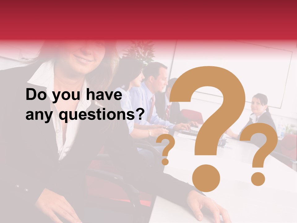 A Woman Sitting At A Table In Front Of A Group Of People PowerPoint Template