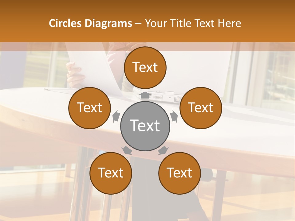 A Woman Sitting At A Table Using A Laptop Computer PowerPoint Template