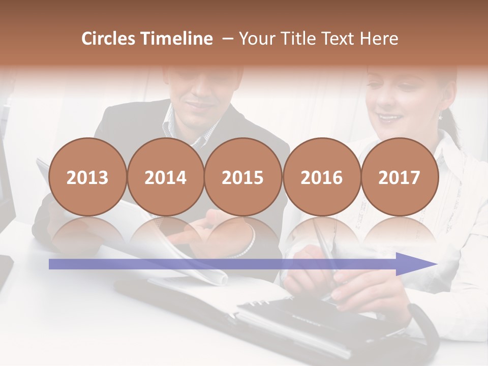 A Man And A Woman Sitting At A Table With Papers PowerPoint Template