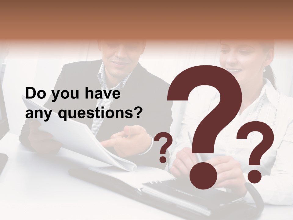 A Man And A Woman Sitting At A Table With Papers PowerPoint Template