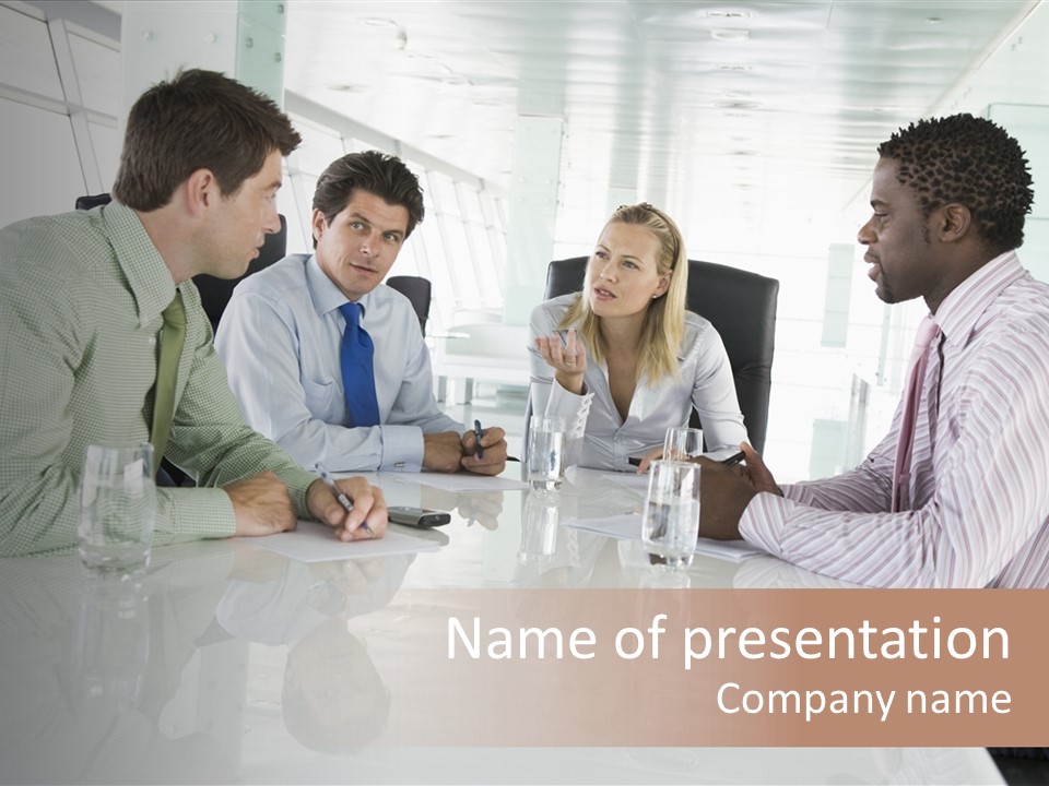 A Group Of People Sitting Around A Conference Table PowerPoint Template