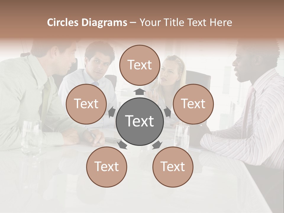 A Group Of People Sitting Around A Conference Table PowerPoint Template