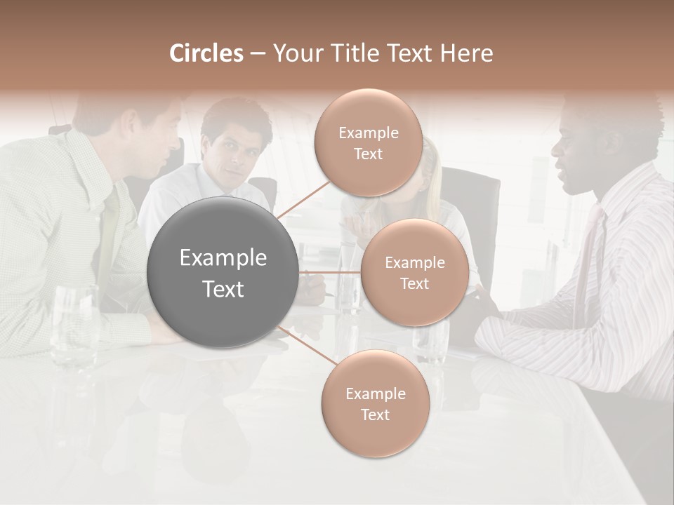 A Group Of People Sitting Around A Conference Table PowerPoint Template