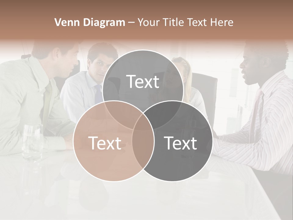A Group Of People Sitting Around A Conference Table PowerPoint Template