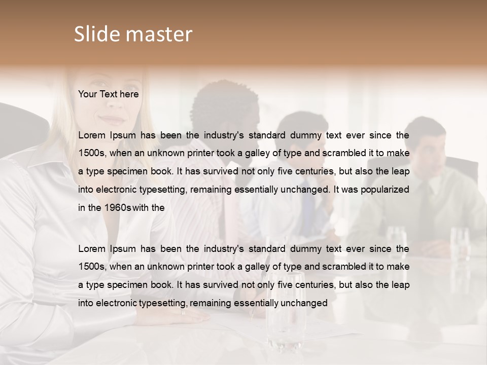 A Group Of People Sitting Around A Conference Table PowerPoint Template