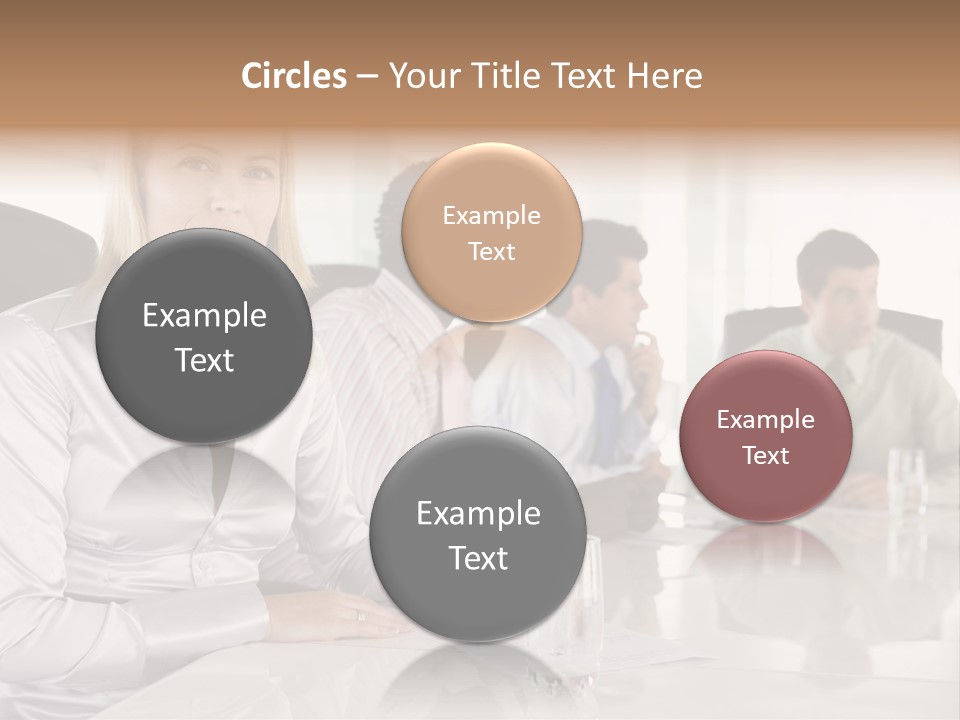 A Group Of People Sitting Around A Conference Table PowerPoint Template