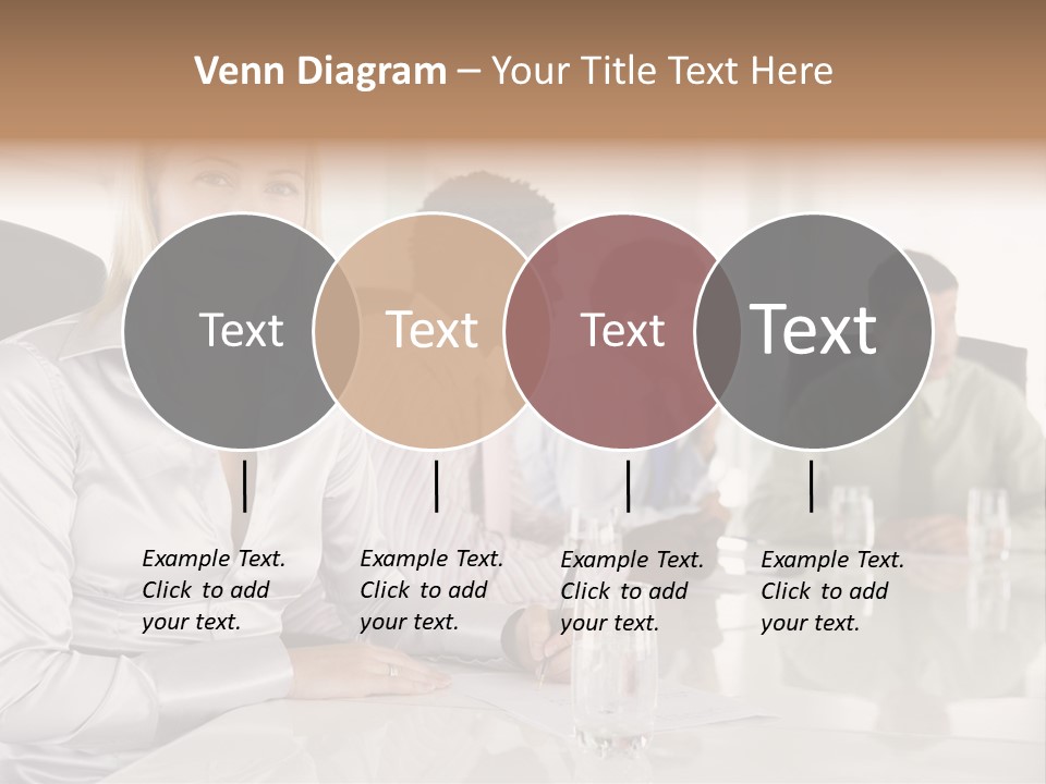 A Group Of People Sitting Around A Conference Table PowerPoint Template
