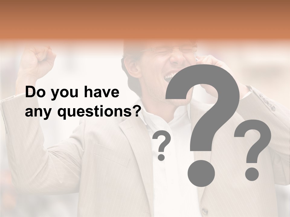 A Man In A Suit Talking On A Cell Phone PowerPoint Template