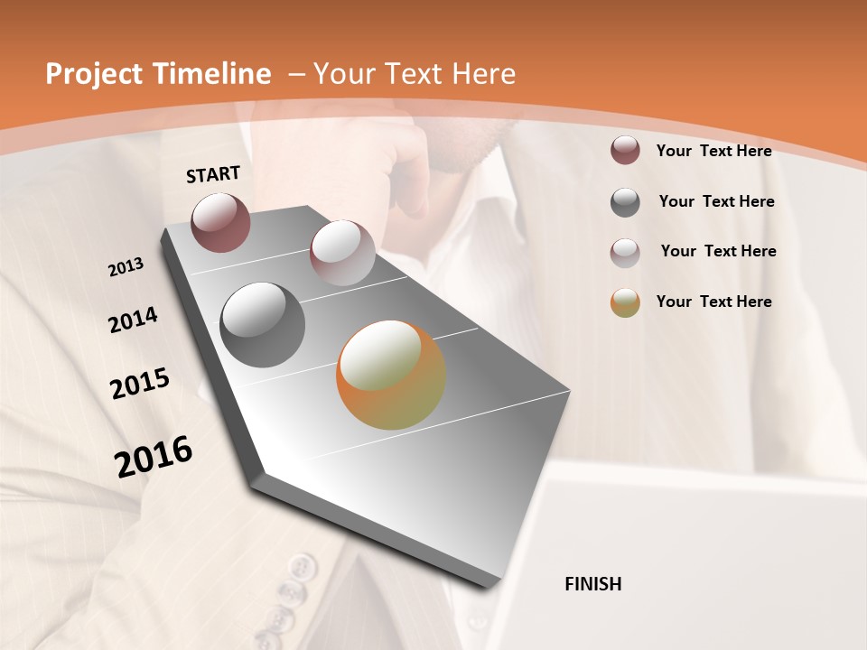 A Man Sitting In Front Of A Laptop Computer PowerPoint Template