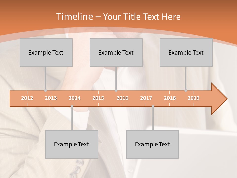 A Man Sitting In Front Of A Laptop Computer PowerPoint Template