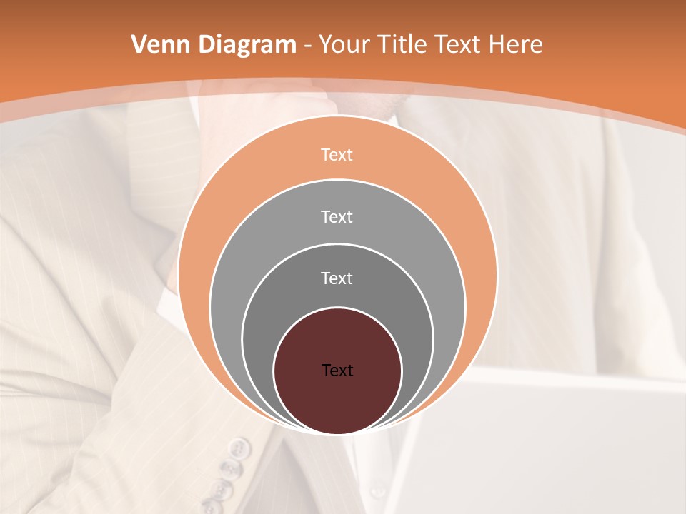 A Man Sitting In Front Of A Laptop Computer PowerPoint Template