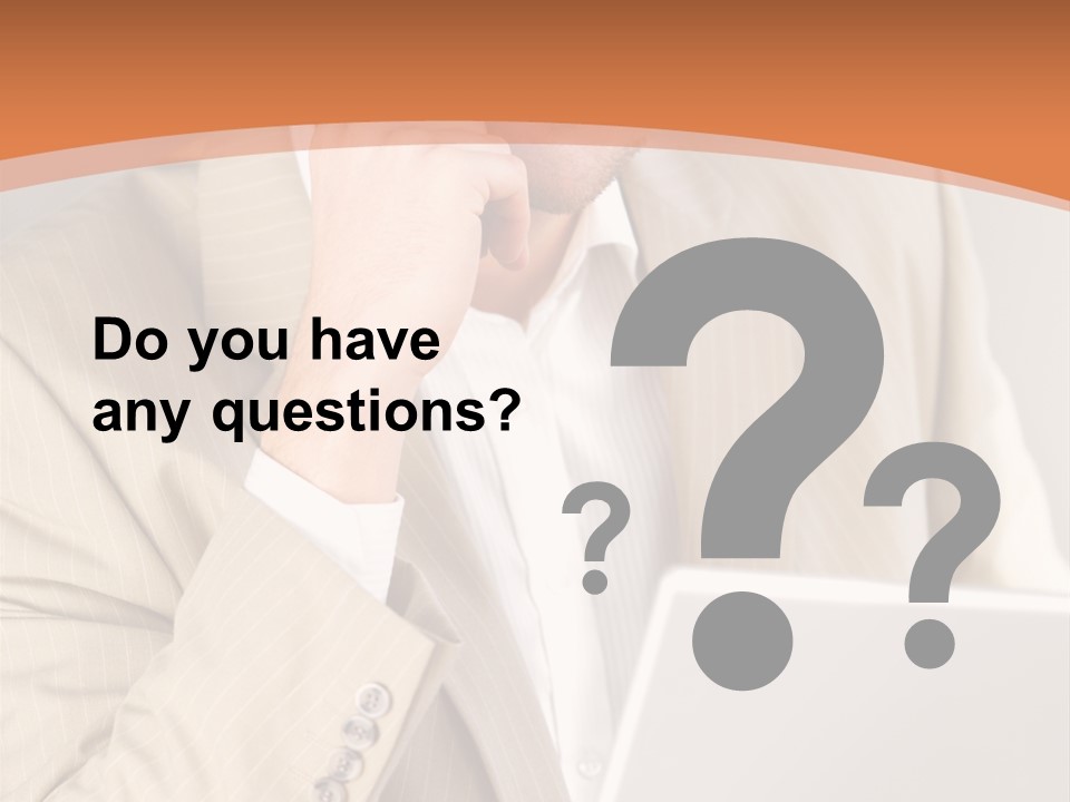 A Man Sitting In Front Of A Laptop Computer PowerPoint Template