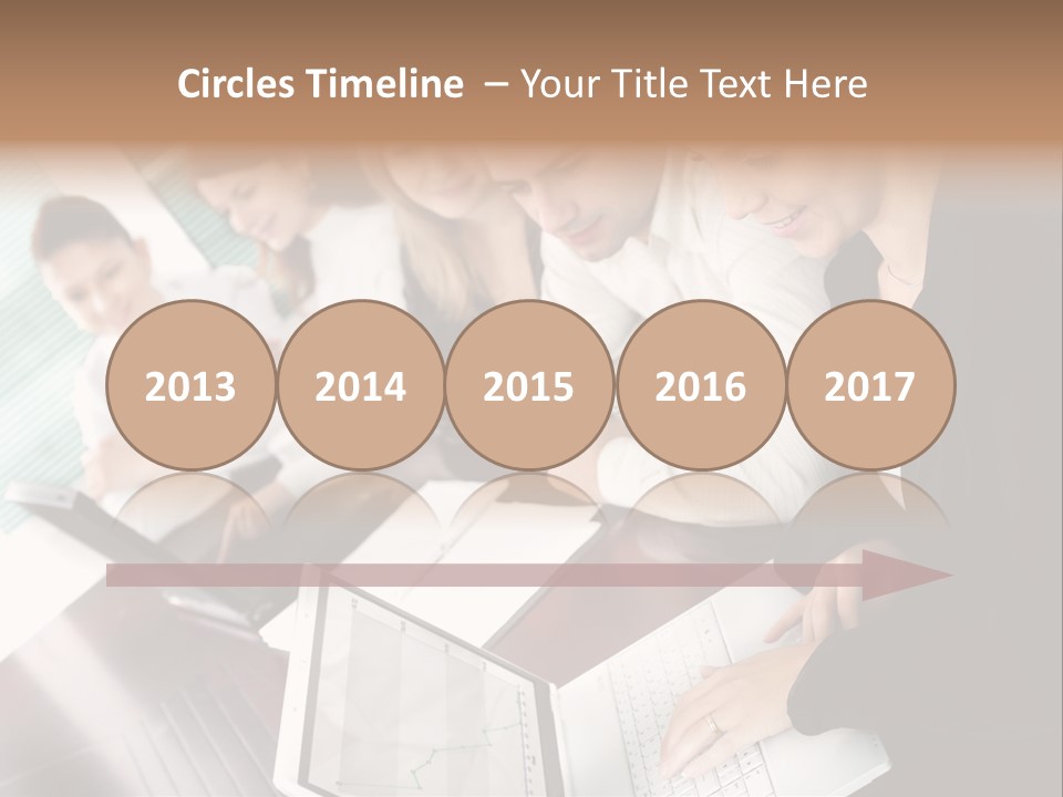 A Group Of People Sitting At A Table With Laptops PowerPoint Template