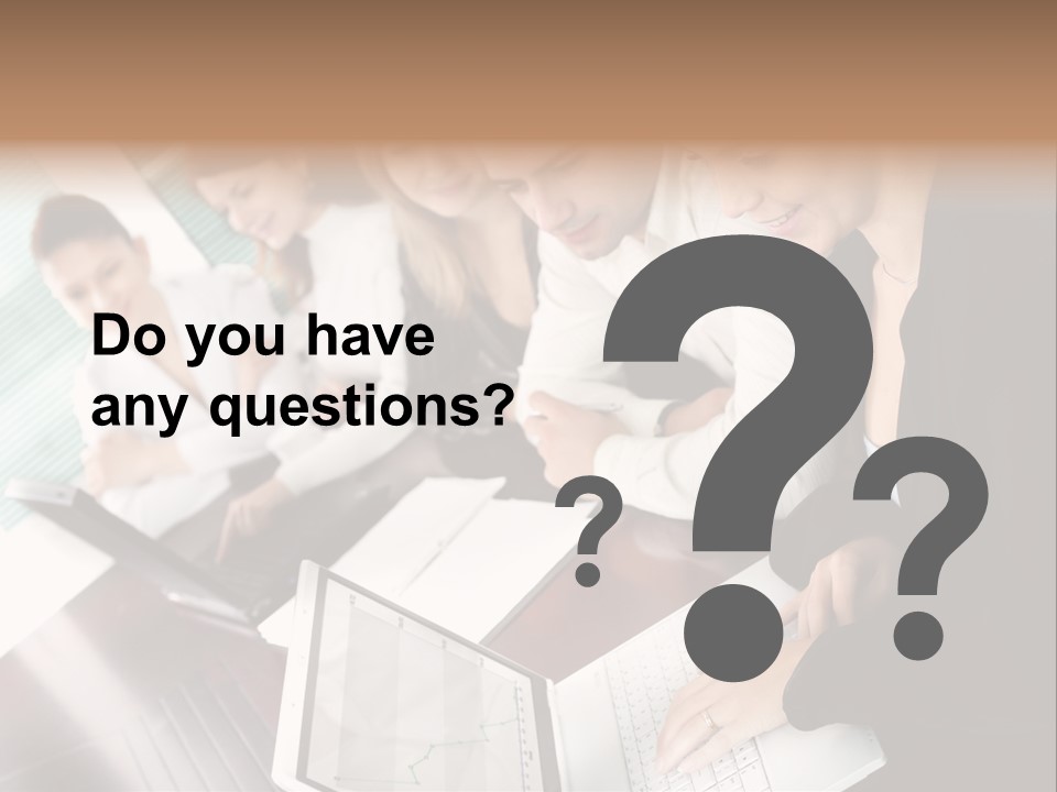 A Group Of People Sitting At A Table With Laptops PowerPoint Template