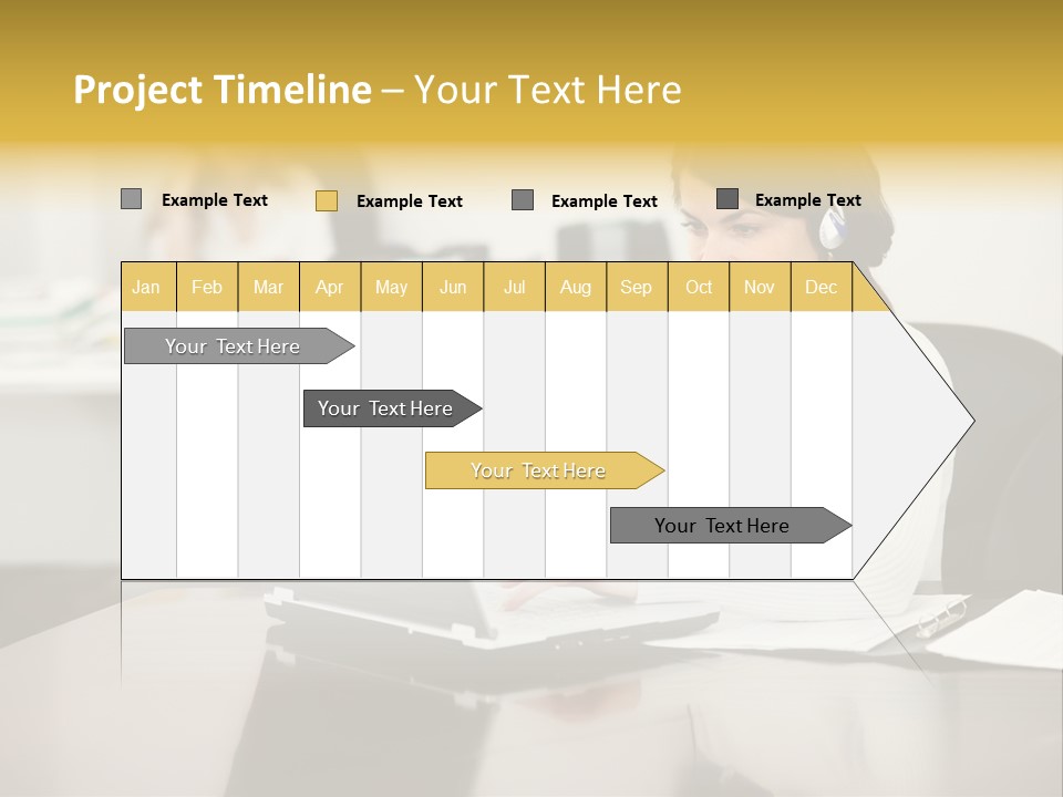 A Woman Sitting At A Desk Using A Laptop Computer PowerPoint Template