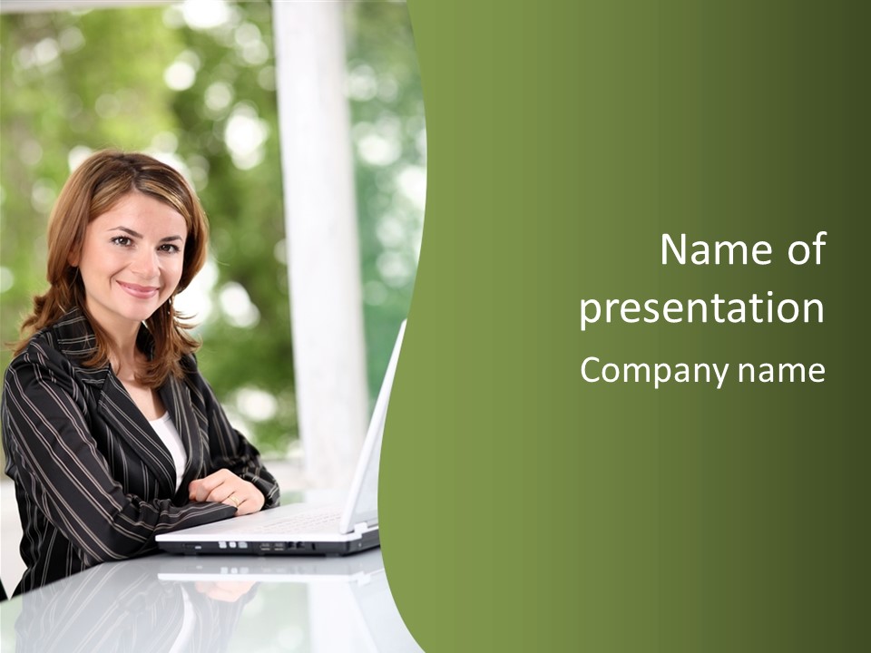 A Woman Sitting At A Desk With A Laptop PowerPoint Template