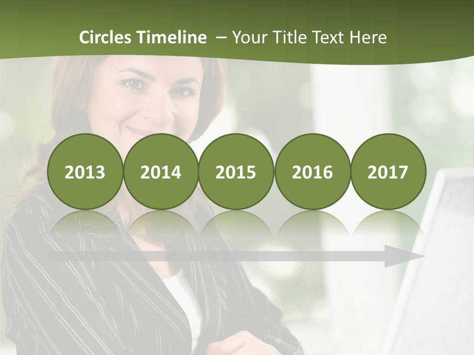 A Woman Sitting At A Desk With A Laptop PowerPoint Template