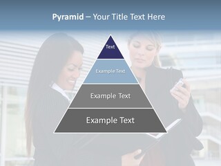 Two Women In Business Attire Looking At A Cell Phone PowerPoint Template