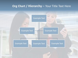 Two Women In Business Attire Looking At A Cell Phone PowerPoint Template