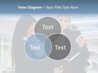 Two Women In Business Attire Looking At A Cell Phone PowerPoint Template
