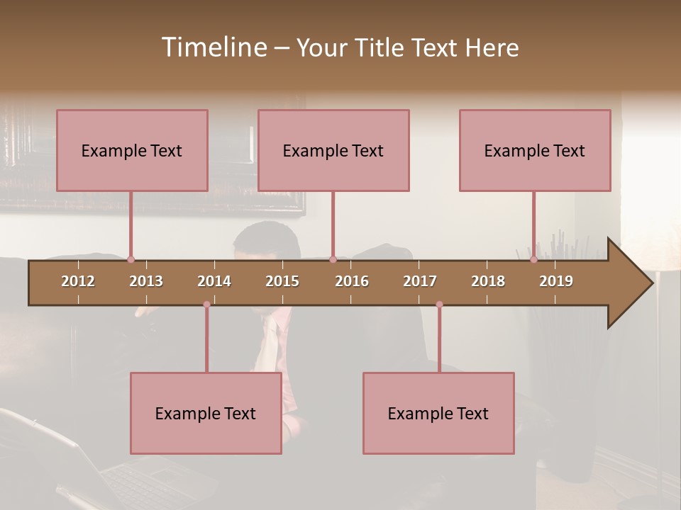 A Man Sitting On A Couch In A Living Room PowerPoint Template