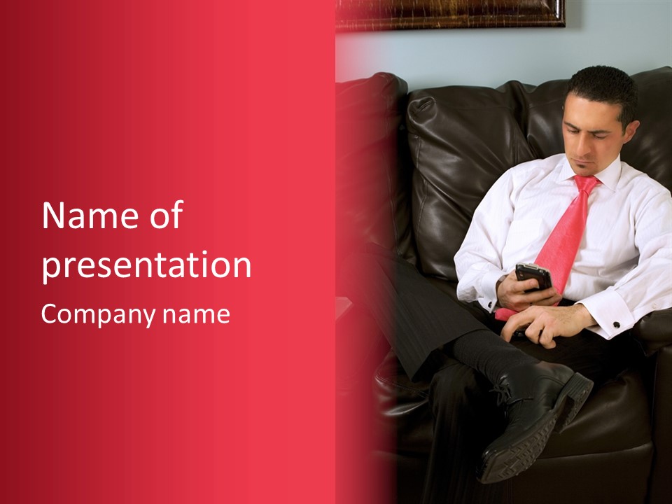 A Man Sitting In A Chair With A Cell Phone PowerPoint Template