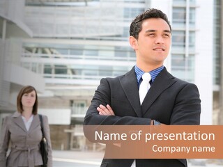 A Man In A Suit Standing With His Arms Crossed PowerPoint Template