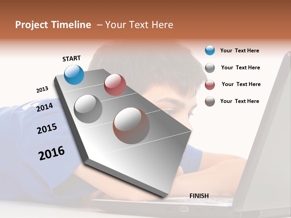 A Young Boy Laying On His Stomach Using A Laptop PowerPoint Template