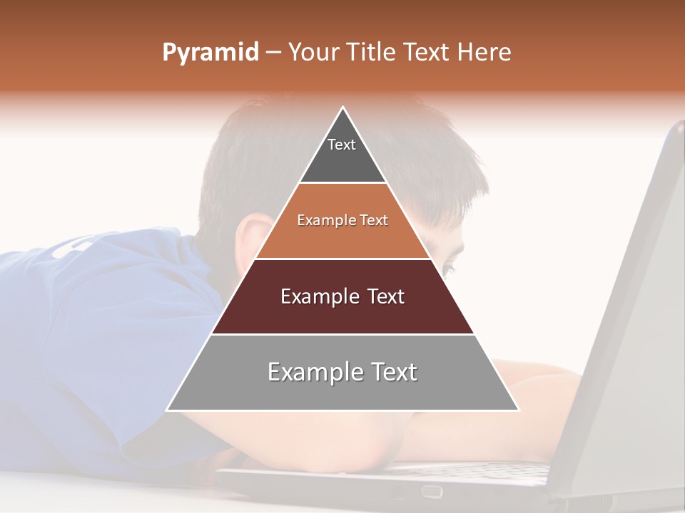 A Young Boy Laying On His Stomach Using A Laptop PowerPoint Template