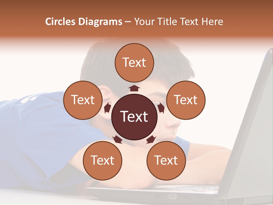 A Young Boy Laying On His Stomach Using A Laptop PowerPoint Template