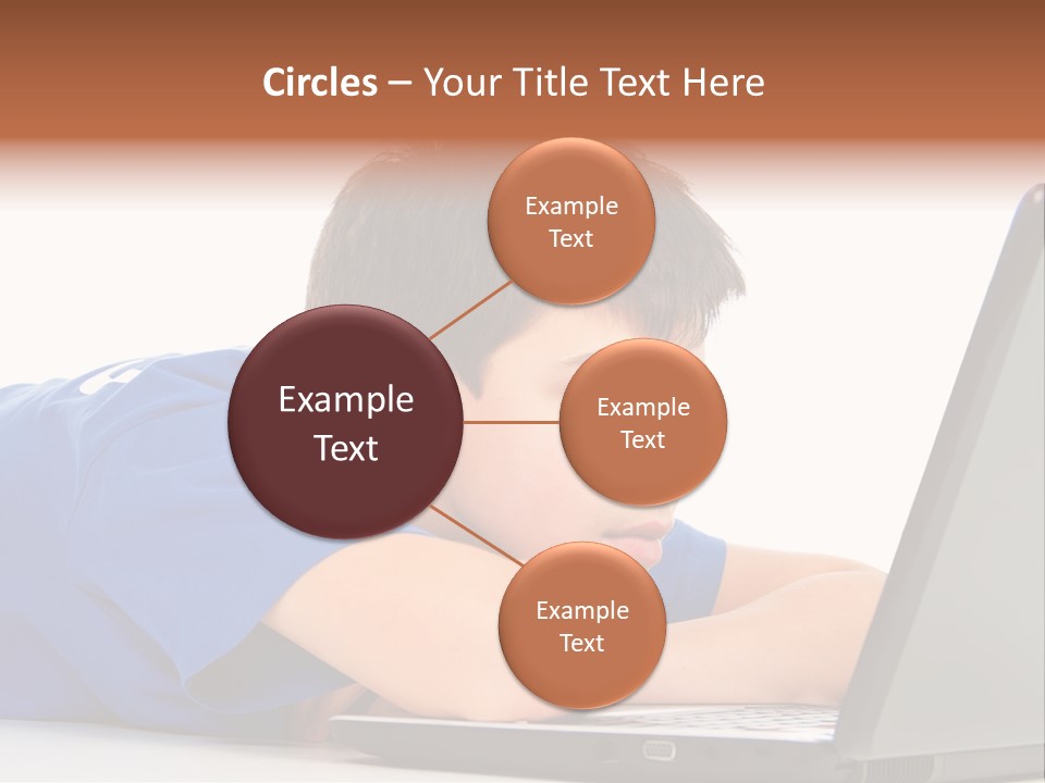 A Young Boy Laying On His Stomach Using A Laptop PowerPoint Template