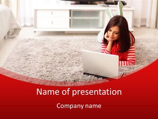 A Girl Laying On The Floor Using A Laptop Computer PowerPoint Template